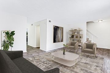 Marietta apartment for rent - A living room with a grey couch, a coffee table, and a painting on the wall.