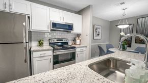 Peachtree Corners apartment for rent - a kitchen with stainless steel appliances and granite counter tops