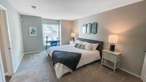 Peachtree Corners apartment for rent - a bedroom with a large bed and a window