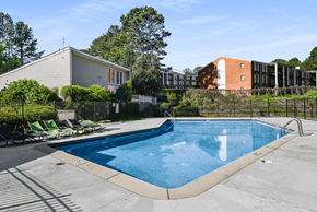 Austell apartment for rent - A swimming pool surrounded by a fence and chairs.