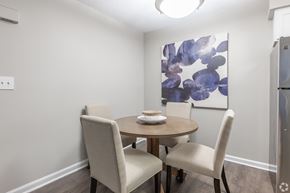 Peachtree Corners apartment for rent - A dining room with a round table and four chairs.
