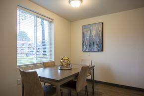 Atlanta apartment for rent - A dining room with a table, chairs and a painting on the wall.