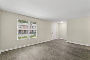 Clarkston apartment for rent - A room with a white door and a window showing a building outside.