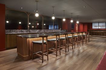 A bar with wooden stools