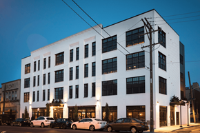 Philadelphia apartment for rent - a large white building with cars parked in front of it