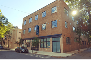 Philadelphia apartment for rent - a brick building on a city street with a car