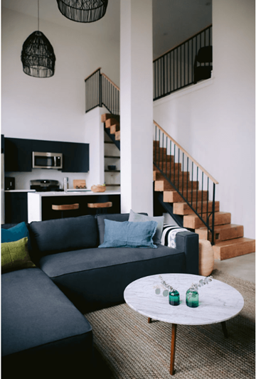 Philadelphia apartment for rent - a living room with a blue couch and a white table