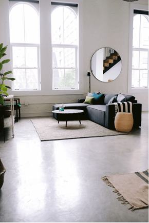Philadelphia apartment for rent - a living room with a couch and a table and a mirror
