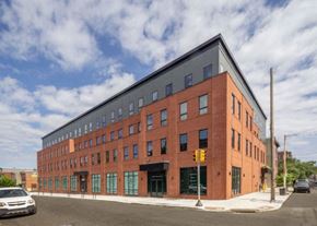 Philadelphia apartment for rent - a large brick building on the corner of a street