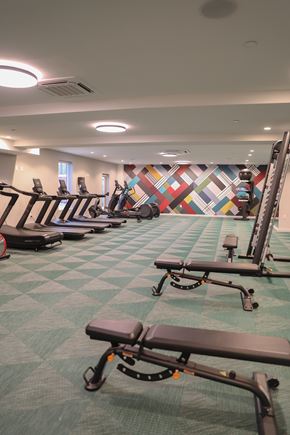 Philadelphia apartment for rent - A gym with a variety of equipment including treadmills and rowing machines.