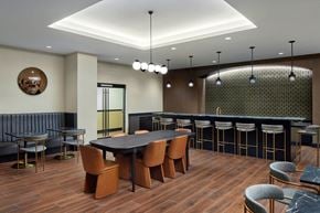 Philadelphia apartment for rent - A modern dining room with a dark wood table and chairs.