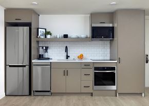 Philadelphia apartment for rent - a modern kitchen with stainless steel appliances and white cabinets