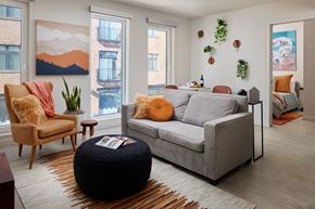 Philadelphia apartment for rent - a living room with a couch and chairs and a rug