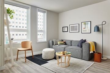 Philadelphia apartment for rent - a living room with a couch and a chair and a window