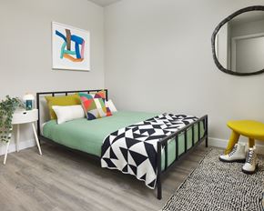 Philadelphia apartment for rent - a bedroom with a bed and a mirror