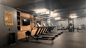 Philadelphia apartment for rent - A gym with a row of rowing machines and a sign that says "You Got This".