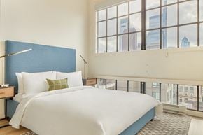 Philadelphia apartment for rent - a bedroom with a large bed and a window