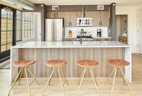 Philadelphia apartment for rent - a kitchen with three stools in front of a counter top