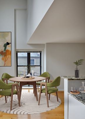 Philadelphia apartment for rent - a dining room with a round wooden table and green chairs