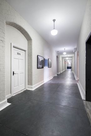 Philadelphia apartment for rent - the hallway of a building with a white door
