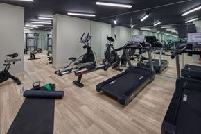 Philadelphia apartment for rent - A gym with a variety of equipment including treadmills, stationary bikes, and weight machines. at The Commonwealth, Philadelphia, Pennsylvania