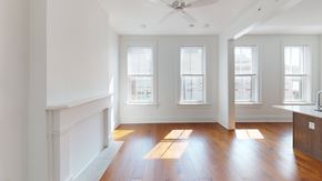 Cinncinati apartment for rent - A room with wooden floors and white walls.
