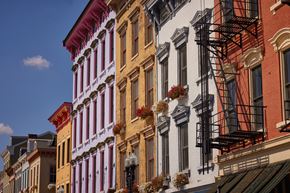 Cincinnati apartment for rent - A row of buildings with fire escapes on the side.