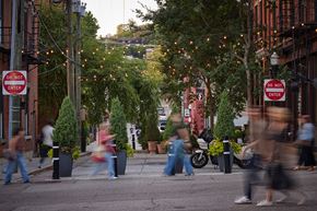 Cincinnati apartment for rent - A street scene with people walking and a "Do Not Enter" sign.