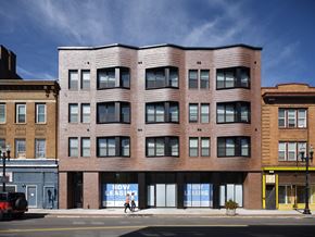 Cincinnati apartment for rent - a large brick building on a city street