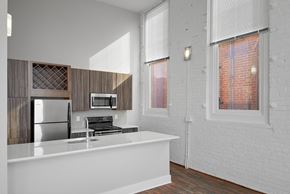 Cincinnati apartment for rent - a kitchen with a counter top and a refrigerator