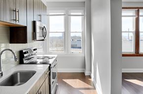 Cincinnati apartment for rent - a kitchen with a sink and a window