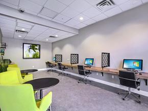 Atlanta condo for rent - a room with a bunch of computers on a table