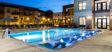 Atlanta condo for rent - a swimming pool at night at an apartment complex