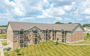 Des Moines apartment for rent - an aerial view of an apartment building with a grassy area in front of it