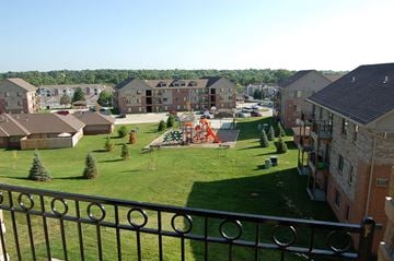 West Des Moines apartment for rent - a view from a balcony of a park with a playground