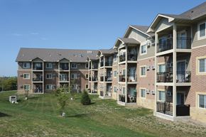 Des Moines townhouse for rent - Apartment complex with multiple buildings and balconies.