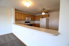 Waukee apartment for rent - a kitchen with a counter and a ceiling fan