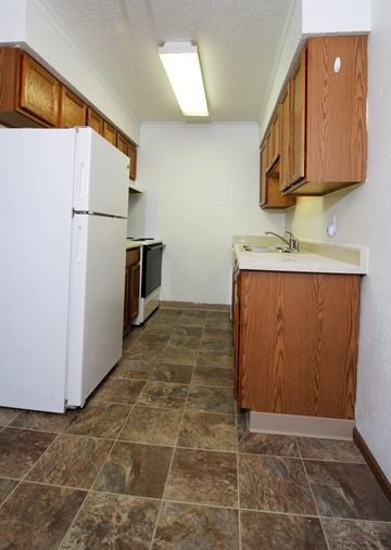 Des Moines apartment for rent - a kitchen with a refrigerator and a sink