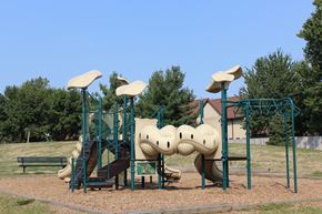 Des Moines apartment for rent - a playground with a slide and climbing equipment