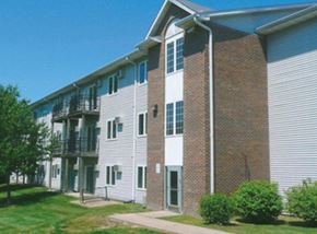 Des Moines apartment for rent - A brick building with a white door and windows.