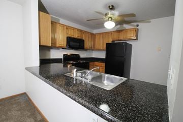 Des Moines apartment for rent - a kitchen with a granite counter top and a sink