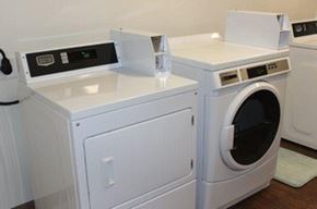 Des Moines townhouse for rent - A white washing machine and dryer sitting next to each other.
