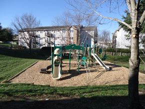 Des Moines apartment for rent - a playground in a park with a building in the background