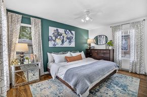 San Antonio apartment for rent - a bedroom with green walls and a white bed at Sunset Ridge, Texas, 78209