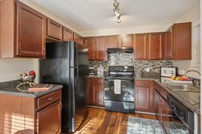 Charlotte apartment for rent - Kitchen with wooden cabinets at Radbourne Lake Apartments, Charlotte, 28269