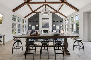 Houston apartment for rent - A large dining room with a wooden table and chairs.
