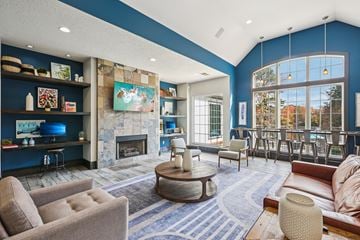 Charlotte apartment for rent - A living room with a fireplace and a painting on the wall.