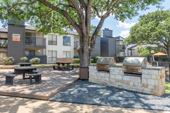 Our apartments have a spacious courtyard with picnic tables and barbecue grills