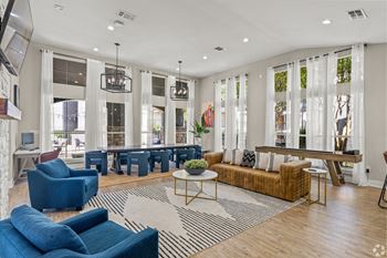 A living room with couches and chairs and a table