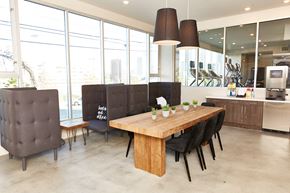 Los Angeles apartment for rent - a large dining room with a wooden table and chairs